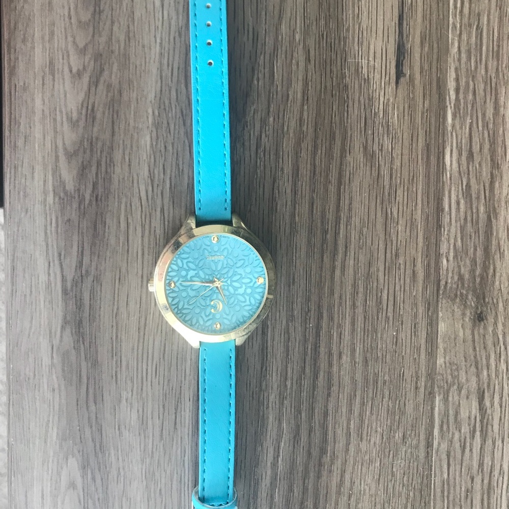 Gold and turquoise watch.